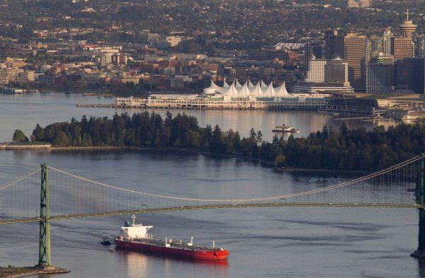An oil tanker goes under the Lions Gate Bridge as it enters Vancouver Harbour on May 5, 2012. Now, the National Energy Board has endorsed an expansion of the Trans Mountain pipeline following a reconsideration of its impact on marine life off the B.C. coast. (The Canadian Press/Jonathan Hayward)