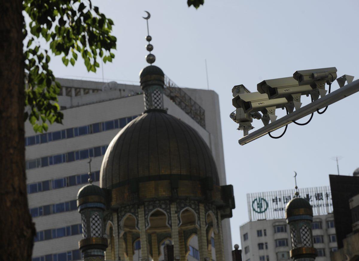 Security cameras are seen (R) on a street in Urumqi, capital of China's Xinjiang region on July 2, 2010. (Peter Parks/AFP/Getty Images)