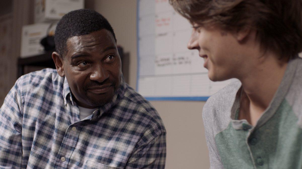 Coach Hailey (Mykelti Williamson, L) encourages Zach (Tanner Stine) in “Run the Race.” (RTR Movie Holdings, LLC)