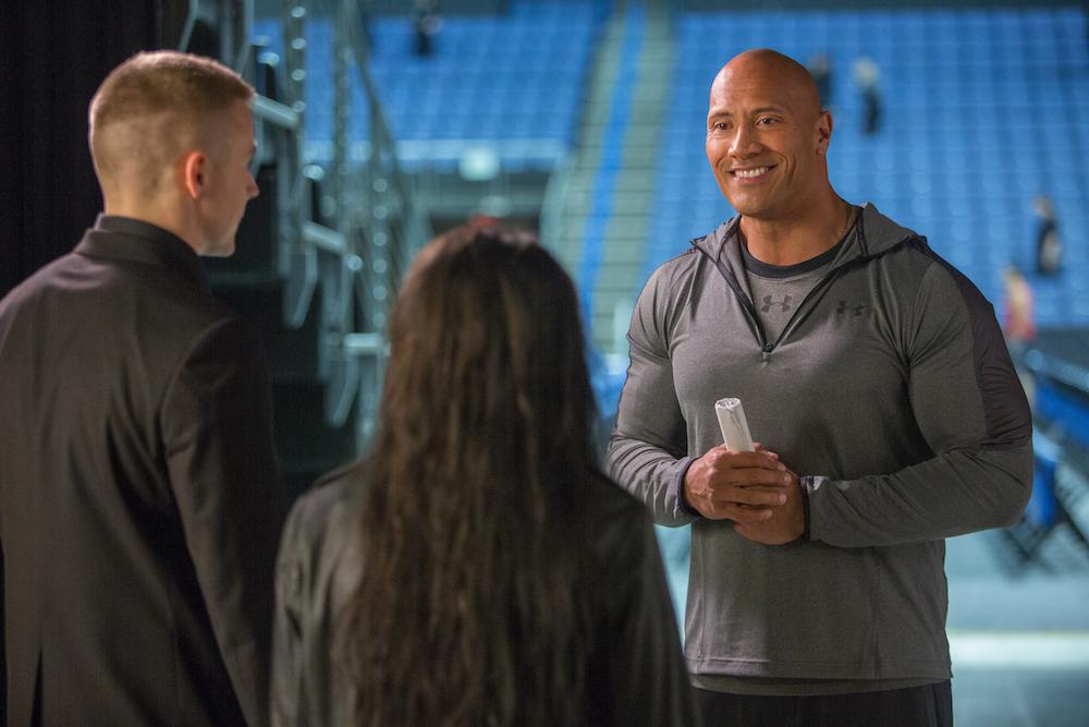 (L–R) Jack Lowden, Florence Pugh, and Dwayne Johnson in “Fighting With My Family.” (Robert Viglasky/Metro-Goldwyn-Mayer Pictures Inc.)