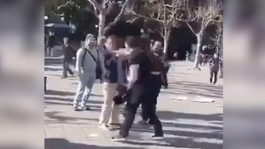 A still image from video footage that showed a man punching a University of California, Berkeley student. (TPUSA)