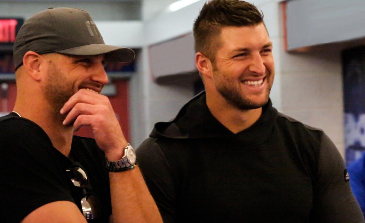 Executive Producers Robby (L) and Tim Tebow share a laugh while filming “Run the Race.” (RTR Movie Holdings, LLC)