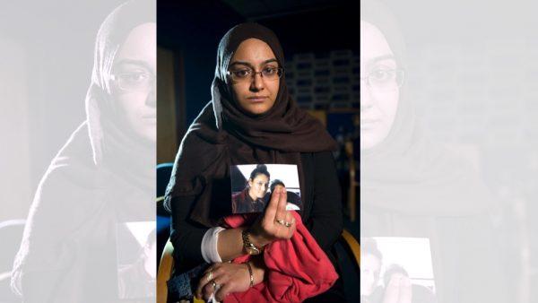 Renu, the eldest sister of Shamima Begum, holds her sister's photo whilst being interviewed by the media at New Scotland Yard, London, UK, on Feb. 22, 2015. (Laura Lean/PA Wire/Getty Images)