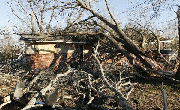 Tornado strewn debris and fallen trees take their toll in this Columbus, Miss., neighborhood, Sunday morning, Feb. 24, 2019. At least one person was killed among the shattered businesses and wrecked homes that dotted the South as severe storms followed a weekend of drenching rains and a rising flood threat. (Rogelio V. Solis/AP)