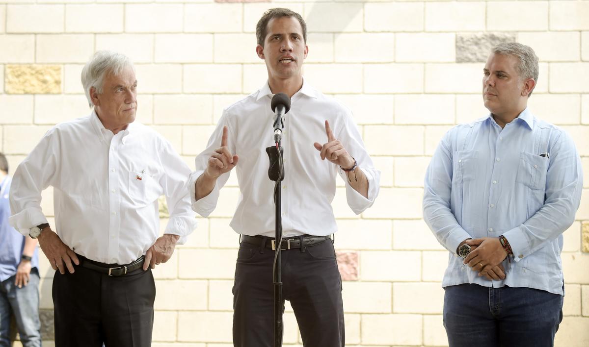 Venezuelan interim president Juan Guaido (C) speaks during a press conference, flanked by presidents Ivan Duque (R) of Colombia and Sebastian Pinera of Chile (L) in Cucuta on the Colombian side of the Tienditas International Bridge on Feb. 23, 2019. (Raul Arboleda/AFP/Getty Images)
