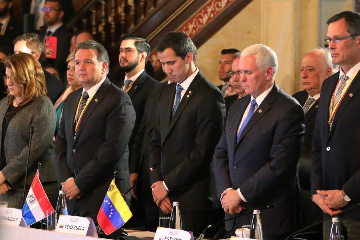 U.S. Vice President Mike Pence and Venezuelan opposition leader Juan Guaido, who many nations have recognized as the country's rightful interim ruler observe a minute of silence in honour of the victims of February 23, during a meeting of the Lima Group in Bogota, Colombia, February 25, 2019. REUTERS/Luisa Gonzalez
