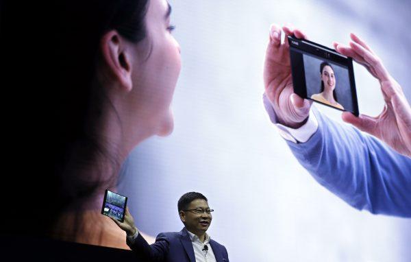 Huawei CEO Richard Yu displays the new Huawei Mate X foldable 5G smartphone at the Mobile World Congress, in Barcelona, Spain on Feb. 24, 2019. The fair started with press conferences on Feb. 24 before the doors opened on Feb. 25, and runs until Feb. 28. (Manu Fernandez/AP)