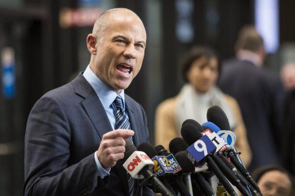 Attorney Michael Avenatti, who is representing an alleged R. Kelly victim, speaks to reporters at the Leighton Criminal Courthouse in Chicago after the R&B singer entered a not guilty plea to all 10 counts of aggravated criminal sexual abuse, Monday morning, on Feb. 25, 2019. (Ashlee Rezin/Chicago Sun-Times via AP)