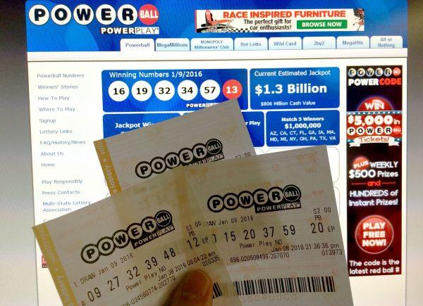 Powerball lottery tickets in front of the splash screen for the powerball.com website in Washington on Jan. 10, 2016. (Karen Bleier/AFP/Getty Images)