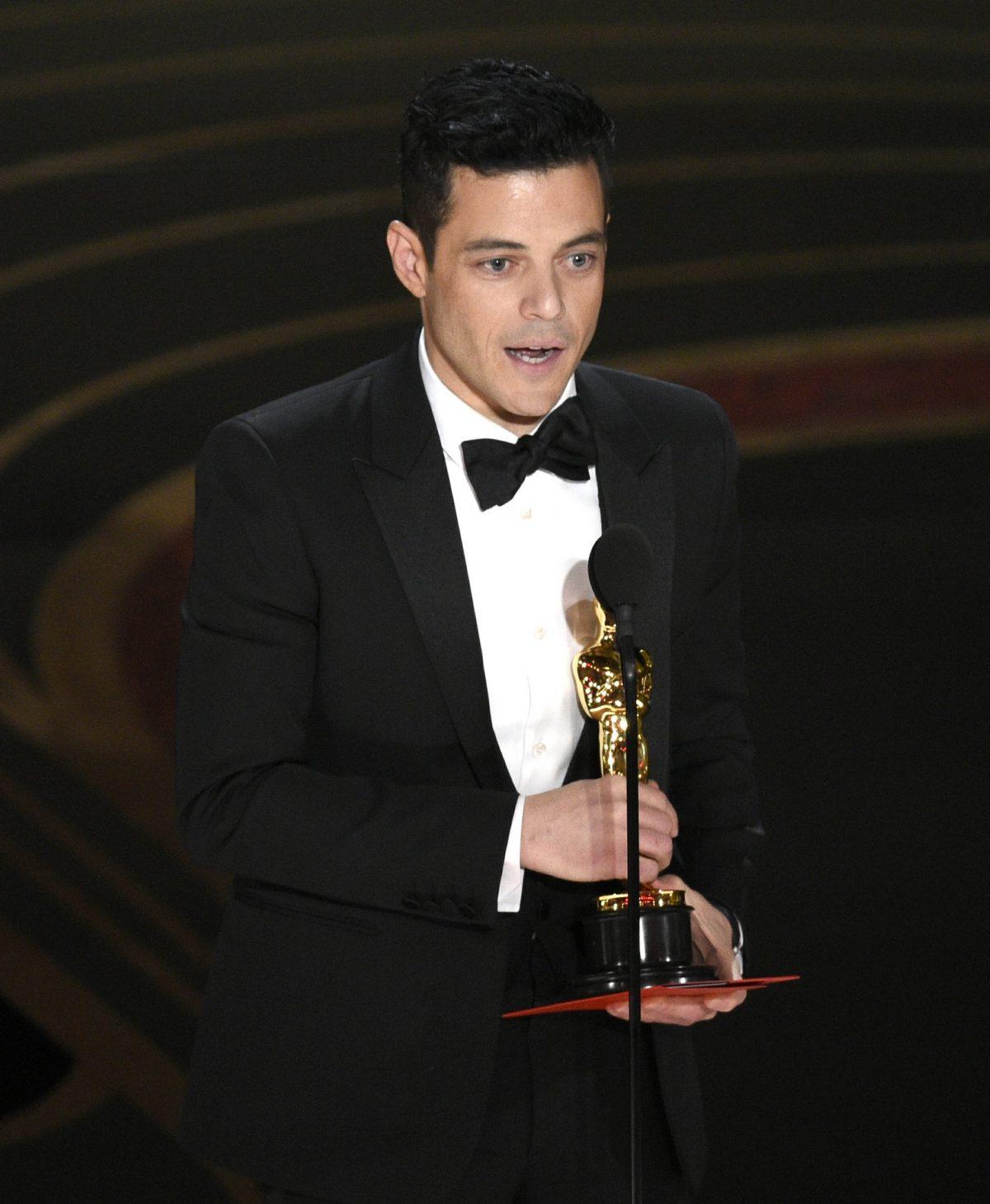 Rami Malek accepts the award for best performance by an actor in a leading role for "Bohemian Rhapsody" at the Oscars, at the Dolby Theatre in Los Angeles, on Feb. 24, 2019, (Chris Pizzello/Invision/AP)