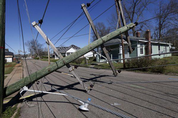 Downed telephone poles on 15th Street in Columbus, Miss., on Feb. 24, 2019. (Rogelio V. Solis/AP)