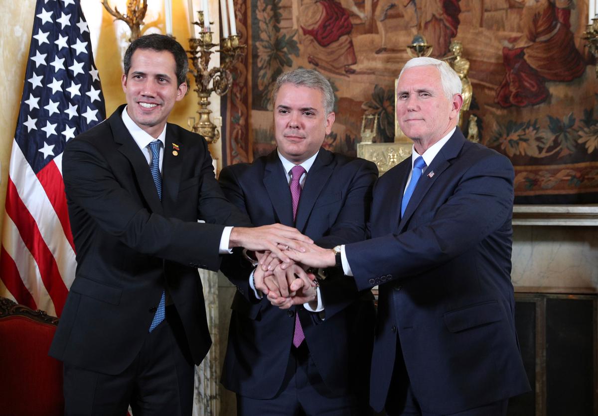 Venezuela interim President Juan Guaido (L), Colombian President Ivan Duque (C), and U.S. Vice President Mike Pence pose for a photo after a meeting of the Lima Group concerning Venezuela at the Foreign Ministry in Bogota, Colombia, on Feb. 25, 2019. (AP/Martin Mejia)