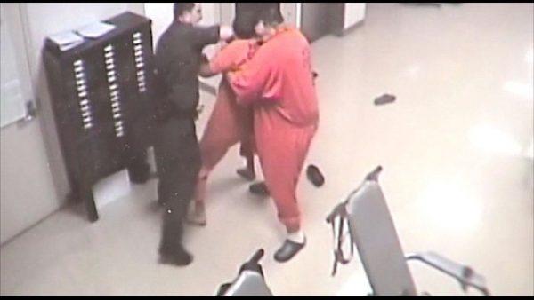 Then, the inmate is restrained (YouTube / Payne County)