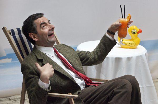 The inimitable Mr Bean, Atkinson's own creation (©Getty Images | <a href="https://www.gettyimages.com/detail/news-photo/british-actor-rowan-atkinson-hams-it-up-for-photographers-news-photo/73666158">JOHN MACDOUGALL</a>)