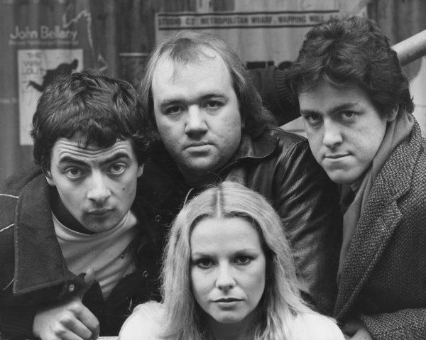 Rowan Atkinson, Griff Rhys Jones, Mel Smith, and Pamela Stephenson from "Not the Nine O'Clock News," 1980 (©Getty Images | <a href="https://www.gettyimages.com/detail/news-photo/british-comedians-rowan-atkinson-mel-smith-and-griff-rhys-news-photo/93435954">Graham Turner</a>)