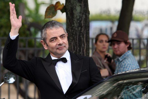Enjoying the accolade in Berlin, 2011 (©Getty Images | <a href="https://www.gettyimages.com/detail/news-photo/british-actor-rowan-atkinson-waves-on-september-27-2011-in-news-photo/127239061">Adam Berry</a>)