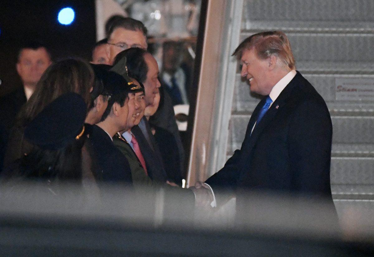 President Donald Trump is greeted after arriving on Air Force One at Noi Bai International Airport, in Hanoi, Vietnam, on Feb. 26, 2019. (AP Photo/Susan Walsh)