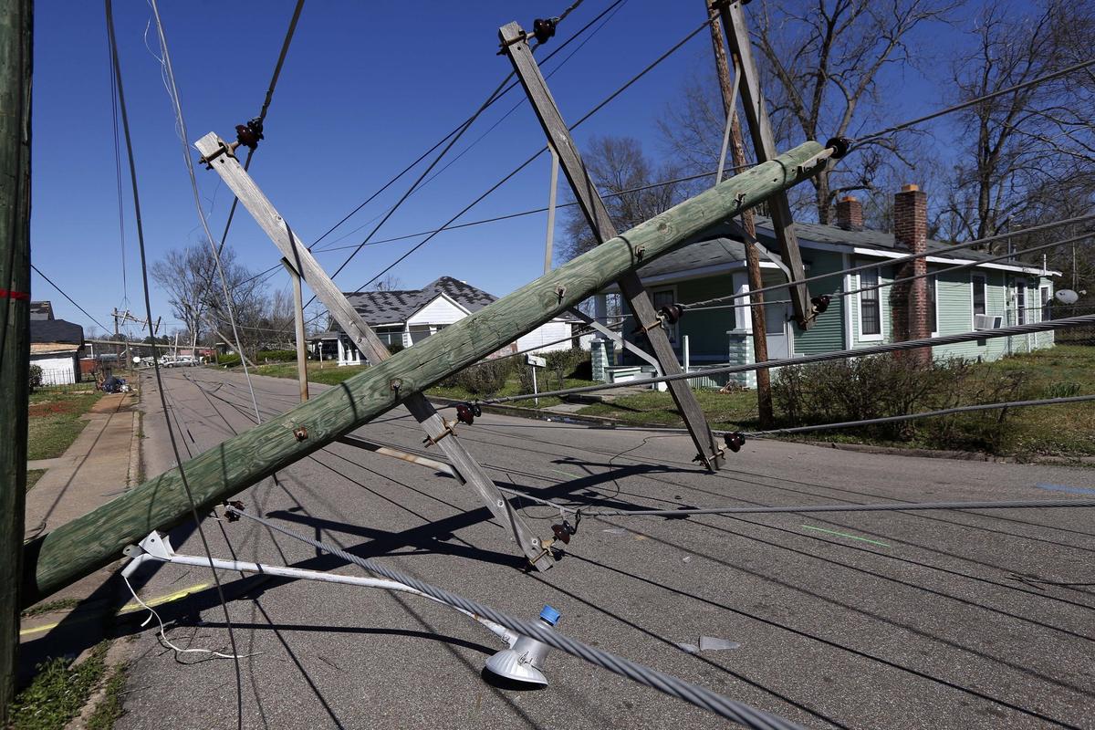 Downed telephone poles on 15th Street in Columbus, Miss., Sunday, Feb. 24, 2019, following Saturday's tornado. (Rogelio V. Solis/AP)