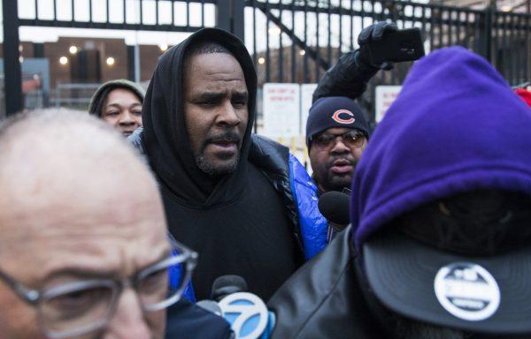 R. Kelly walks out of Cook County Jail with his defense attorney, Steve Greenberg, after posting $100,000 bail in Chicago, on Feb. 25, 2019. (Ashlee Rezin/Chicago Sun-Times via AP)