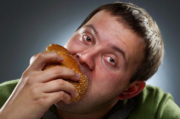 Eating until feeling ill (Quorthon1/Shutterstock)