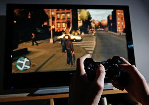 A young man plays "Grand Theft Auto IV" on the game's day of release on April 29, 2008. (Cate Gillon/Getty Images)