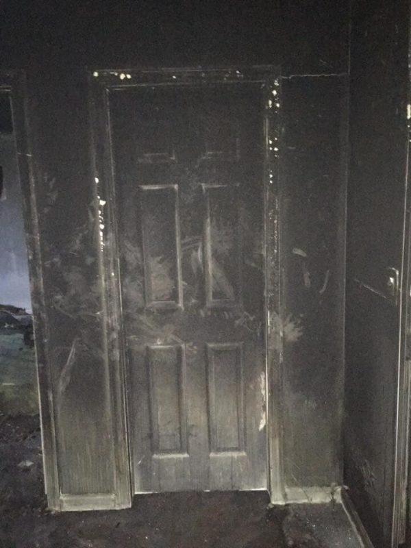 The outside of the door, blackened by fire. (New Fairfield Volunteer Police Department)