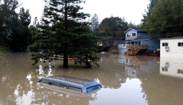 A truck sits submerged in floodwaters in Forestville, Calif., on Feb. 28, 2019. (Josh Edelson/AP)