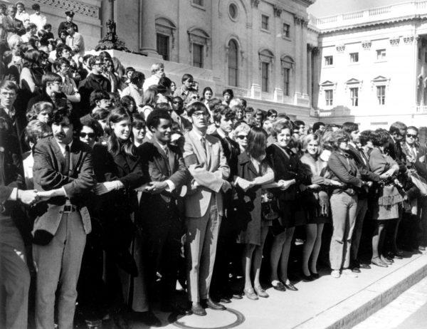 Anti-war demonstrators, wearing black armbands, fill the steps of the United States Capitol Building and hold hands on the day of the National Moratorium in Washington D.C., to protest against the continuing war in Vietnam, on Oct. 15, 1969. (AFP/Getty Images)