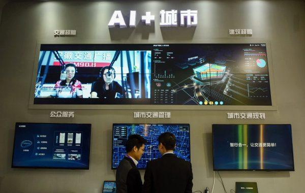 Visitors look at an AI smart city system by iFLY at the 2018 International Intelligent Transportation Industry Expo in Hangzhou in China's eastern Zhejiang province in December 2018. (STR/AFP/Getty Images)