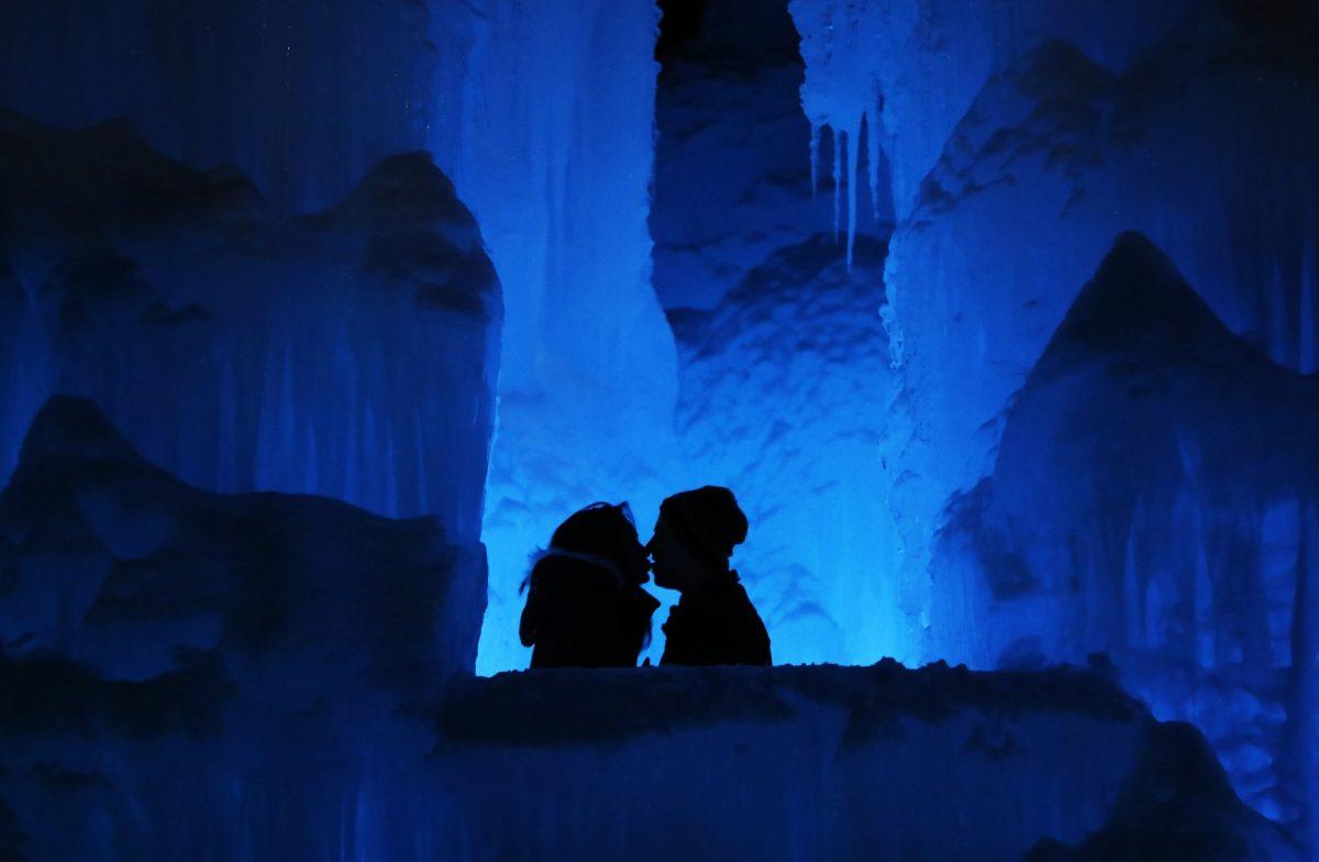 A couple enjoys the Ice Castles in North Woodstock, N.H., on Jan. 25, 2019. "It's a really popular date night spot," said castle builder Matt Pasciuto. "I can't tell you how many marriage proposals I've seen so far in the castle." (Robert F. Bukaty/AP Photo)