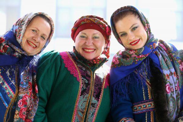 The 'Kazak Singers' dressed in their traditional Russian outfit smile at Rosa Khutor Mountain Cluster village on day five of the Sochi 2014 Winter Olymipcs on Feb. 12, 2014, in Sochi, Russia. (©Getty Images | <a href="https://www.gettyimages.com/detail/news-photo/the-kazak-singers-dressed-in-their-traditional-russian-news-photo/468925991">Alexander Hassenstein</a>)