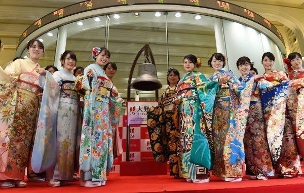 Employees in Japanese traditional kimonos pose during the Tokyo Stock Exchange's new year business ceremony in Tokyo on Jan. 4, 2019. (©Getty Images | <a href="https://www.gettyimages.com/detail/news-photo/employees-in-japanese-traditional-kimonos-pose-during-the-news-photo/1076914274">Toshifumi Kitamura/AFP</a>)