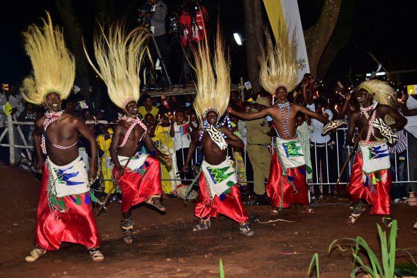 Men dressed in traditional tribal clothes dance during a visit by Pope Francis with the Munyonyo community on Nov. 27, 2015, in Kampala. (©Getty Images | <a href="https://www.gettyimages.com/detail/news-photo/men-dressed-in-traditional-tribal-clothes-dance-during-a-news-photo/498958232">Guiseppe Cacace/AFP</a>)