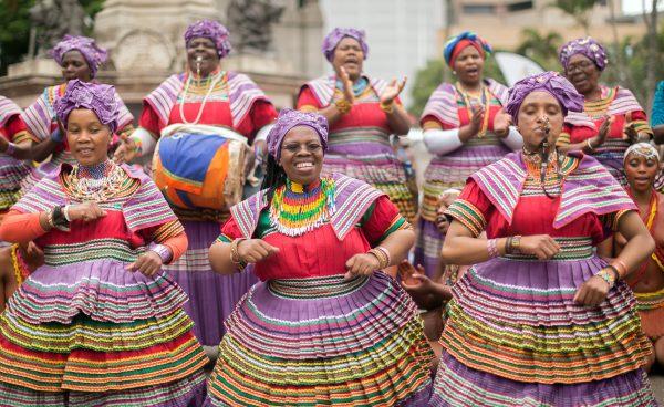 Women in their traditional Basotho outfits sing and dance in the streets during the Indoni SA Cultural Festival on Oct. 7, 2017, in Durban.<br/>The Indoni festival, a three-day feast, showcases traditions of South African provinces and aims to demonstrate unity and the unique diversity of the country. (©Getty Images | <a href="https://www.gettyimages.com/detail/news-photo/women-in-their-traditional-basotho-outfits-sing-and-dance-news-photo/858689362">Rajesh Jantilal/AFP</a>)