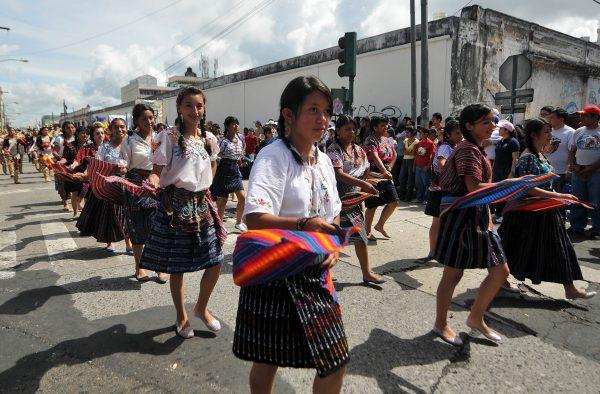 Guatemalan students dressed in traditional native costumes take part in a parade during the Independence Day celebrations, in Guatemala City, on Sept. 15, 2010. (©Getty Images | <a href="https://www.gettyimages.com/detail/news-photo/guatemalan-students-dressed-in-traditional-native-costumes-news-photo/104127738">Johan Ordonez/AFP</a>)
