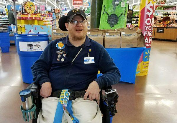 Walmart greeter John Combs poses for a picture as he works at a Walmart store in Vancouver, Wash., on April 21, 2018. (Rachel Wasser via AP)