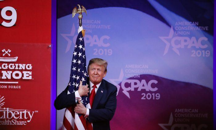 President Trump Embraces American Flag Before CPAC Speech
