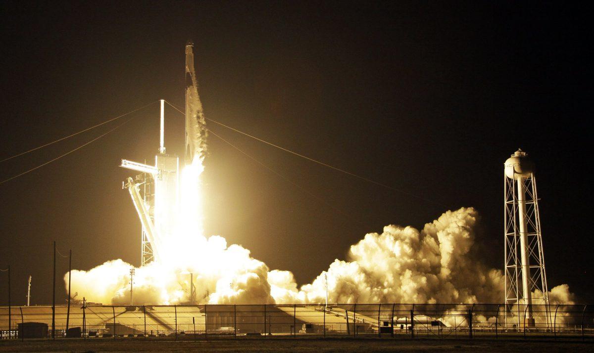 A SpaceX Falcon 9 rocket with a demo Crew Dragon spacecraft lifts off Saturday, March 2, 2019. (AP Photo/Terry Renna)