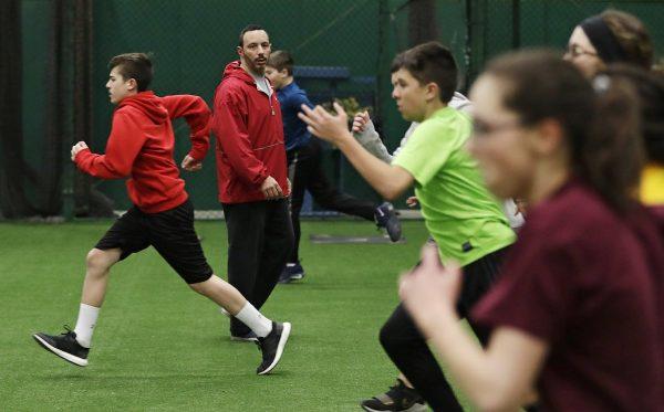 Anthony Sarigianopoulos trains children and young adults at the Sluggers of Ohio gym in Youngstown, Ohio. On Feb. 27, 2019. (AP Photo/Tony Dejak)