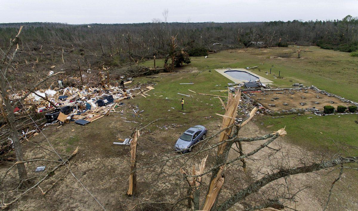 Debris from a home litters a yard the day after a tornado blew it off its foundation in Beauregard, Ala., on March 4, 2019. (David Goldman/AP Photo)