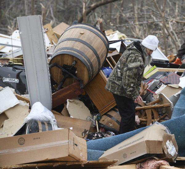 Julie Morrison looks through the debris of her destroyed home on Lee County Road 63 in Beauregard, Ala., on March 4, 2019. Tornadoes ravaged the area Sunday causing multiple fatalities. (Julie Bennett/AP Photo)