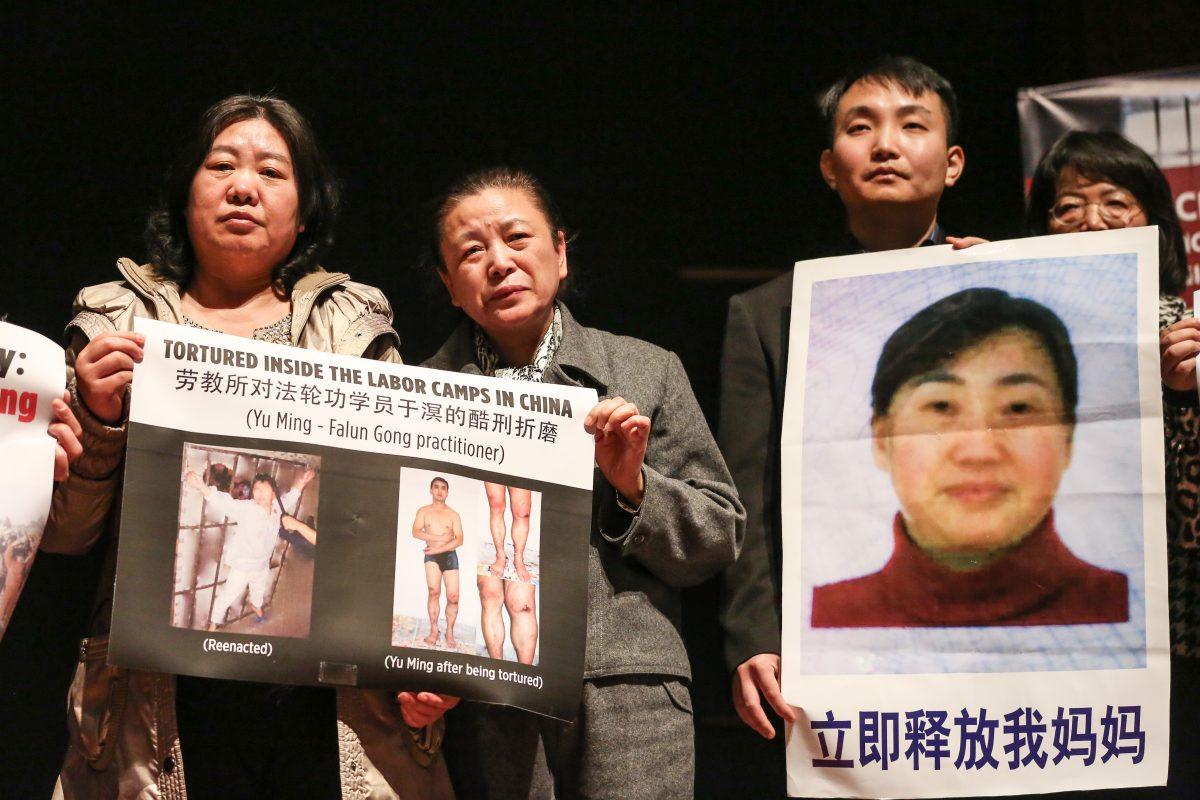 Falun Gong practitioners of Washington hold pictures of family members or lawyers still imprisoned in China for practicing Falun Gong or defending Falun Gong at the at the press conference to announce the Formation of The Coalition to Advance Religious Freedom in China (CARFC) at The Congressional Auditorium in the Capitol Visitor Center, Washington, on Mar. 4, 2019. (Jennifer Zeng/The Epoch Times)