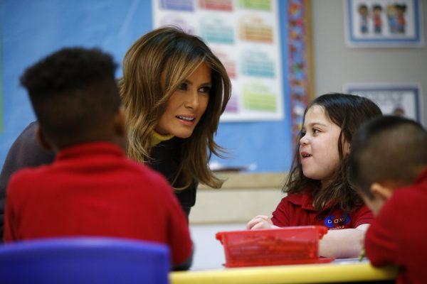 First Lady Melania Trump leans in to listen to a student at Dove School of Discovery in Tulsa, Okla., on March 4, 2019. (Patrick Semansky/AP Photo)