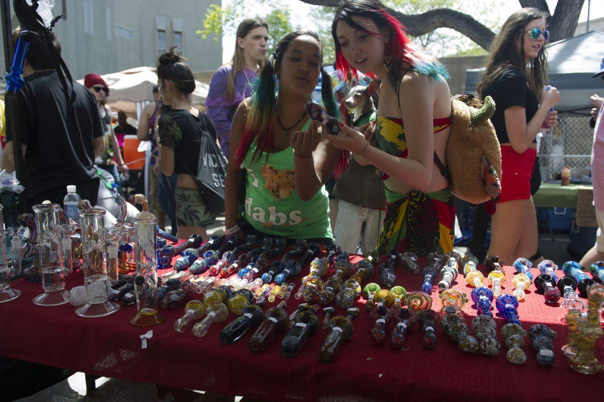 People explore various cannabis paraphernalia during the Denver 420 Rally, the world's largest celebration of both the legalization of cannabis and cannabis culture, in Denver Colo., on May 21, 2016. (JASON CONNOLLY/AFP/Getty Images)