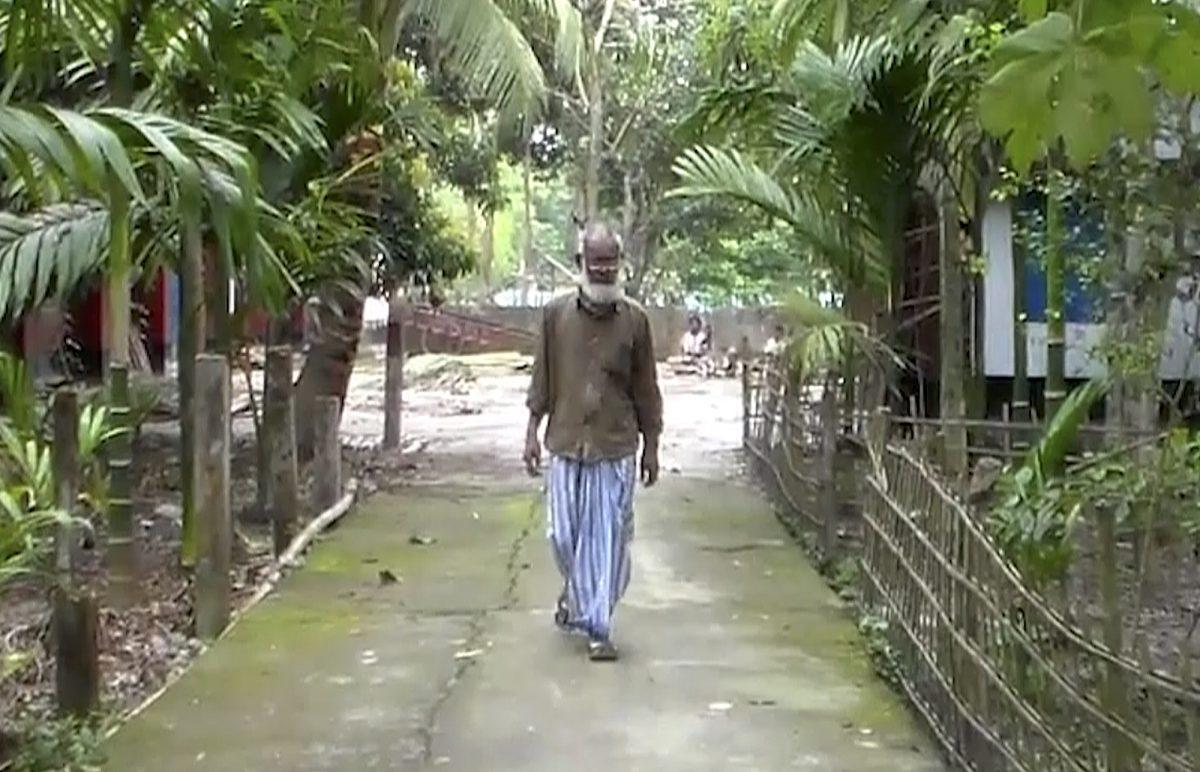 Shamima Begum’s father, Ahmed Ali, walks through his village of Sunamganu, Bangladesh, on March 5, 2019. (AP Photo)