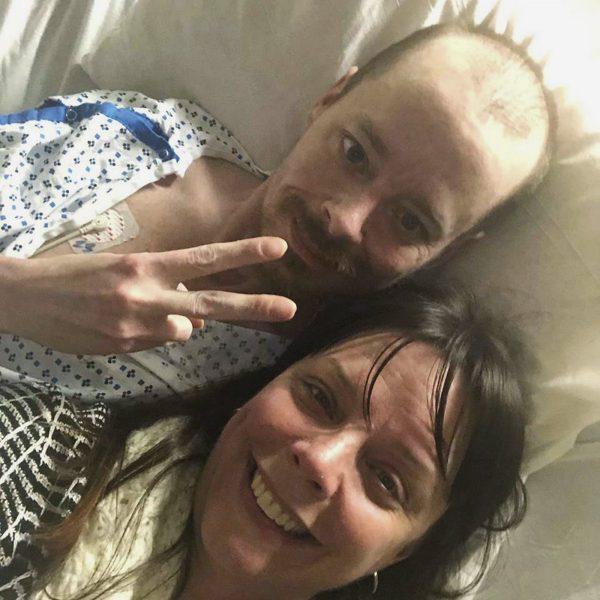 Selfie provided by Bridgette Hoskie, her brother Jay Barrett and herself pose for the photo inside an ICU at Yale New Haven Hospital in New Haven, Conn., on Feb. 26, 2019. Barrett, a terminally ill Connecticut man who's a big supporter of President Donald Trump, is getting a bucket list wish fulfilled, with help from his Democratic sister. (Bridgette Hoskie via AP)