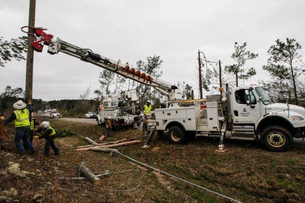 Alabama Power begins putting up poles March 4, 2019, to get power restored in Beauregard, Ala., after a tornado.  (Tami Chappell/AFP/Getty Images)