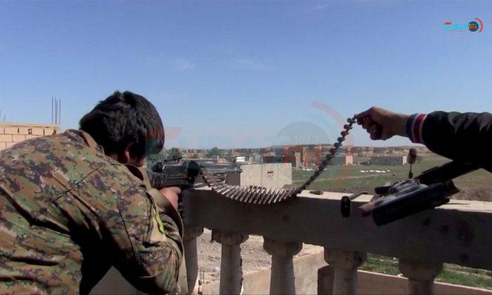 Hundreds of ISIS fighters surrender in east Syria