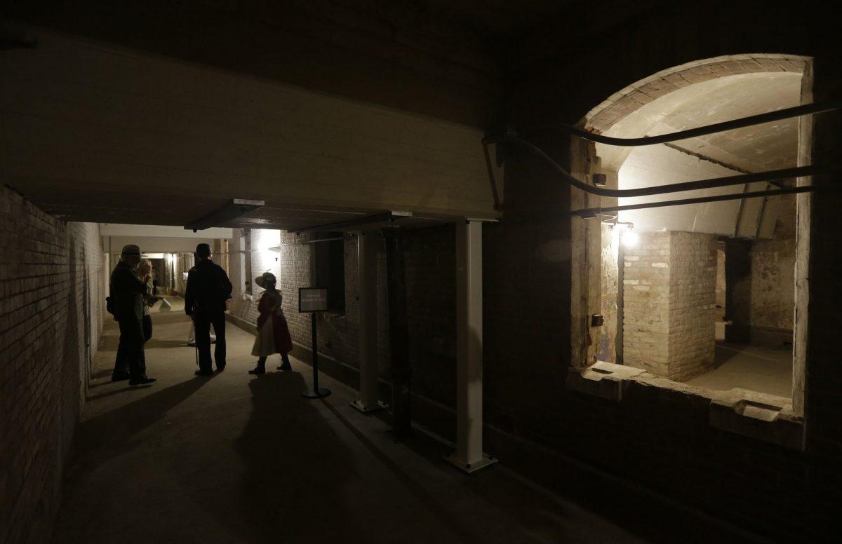 People walk through the citadel, also known as the dungeon, during a tour of newly restored areas on Alcatraz Island in San Francisco, on July 1, 2015. (Eric Risberg/AP Photo, File)
