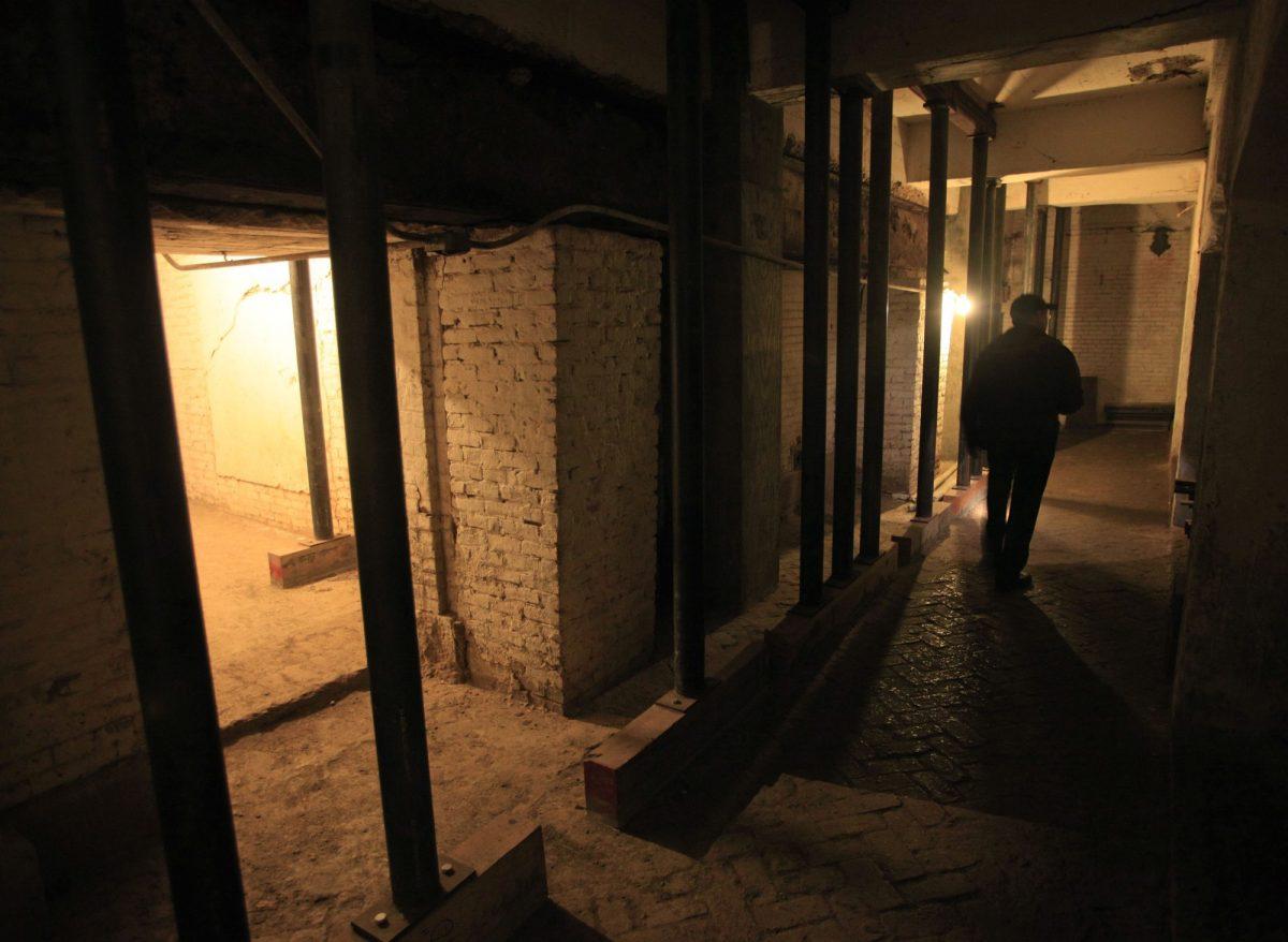 Jim Breeden of the Golden Gate National Parks Conservancy walks through the dungeons below the main cell house during a night tour on Alcatraz Island in San Francisco on July 7, 2011 (Eric Risberg/AP Photo, File)